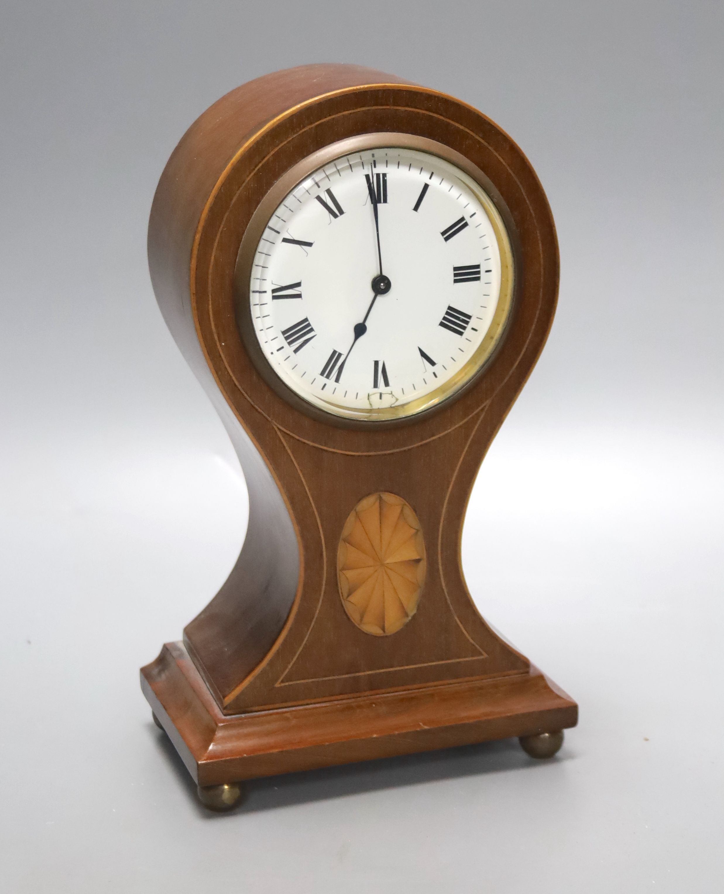 An Edwardian inlaid mahogany balloon cased timepiece, height 24cm